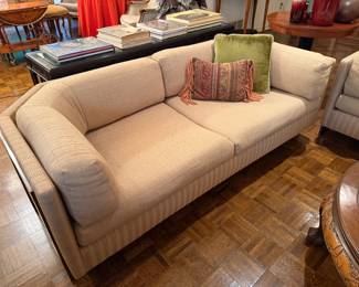 Beige fabric with metal details. I know it’s designer, but I cannot find the designer.