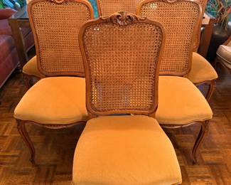 Set of six French style dining chairs with gold upholstery and came back. Beautiful carve details.