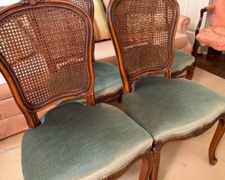 Set of four Green velvet cane back French style chairs