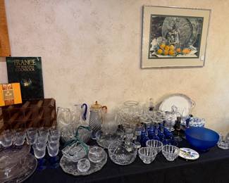 Glassware collection - lots of blue stemware , some Waterford