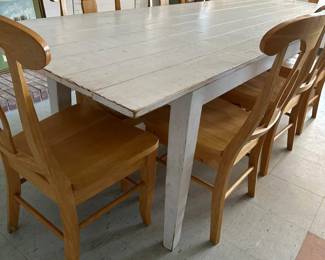 Long wooden harvest table with 8 chairs ( 8-9 ft?)