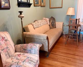 Antique sleeper sofa, vintage high chair, old photos and antique plant stand lamp 