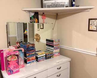 Box tv with dvd player and remote. A lot of kids DVDs. Vintage Barbies new in box 