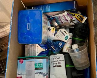 aquariums supplies such as feeders, filters, testing kits, food