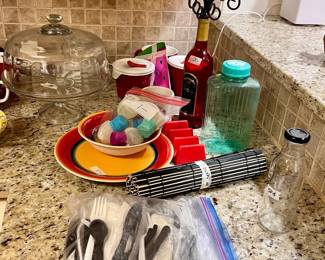 sushi roller, glass cake tray and cover, soup cups with covers, wine bottle candle holder