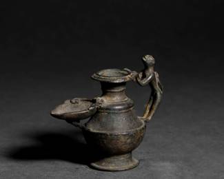 Lot 214 Tibetan Bronze Zoomorphic Oil Lamp with Monkey Handle, 18th C.