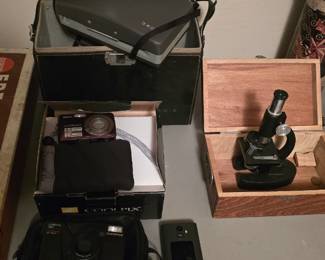 vintage cameras and a microscope
