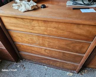 midcentury dressers legs are in drawer