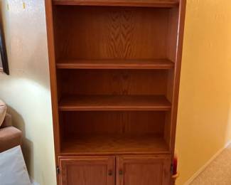 Tall Four Shelf Bookcase With Two Shelves Behind Doors