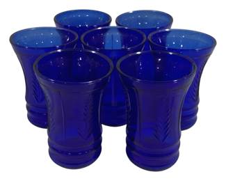 2077 - 7 Blue Glasses 4" (Description): A set of seven blue glasses. Each glass  measures 4 inches in height.