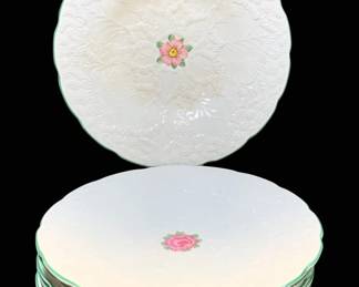 2049 - 8 Wedgwood Plates 9" Round (Description): Set of eight Wedgwood plates featuring a  delicate floral design with pink rose center  motifs and green trim edges. Each plate  measures 9 inches round.