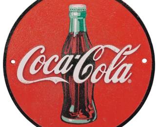 94 - Cast Iron Coca-Cola Round Advertising Sign (Description): Cast iron Coca-Cola advertising sign  featuring the iconic contour bottle design  against a classic red background. The round  sign displays the trademarked Coca-Cola  script logo in white and includes two mounting holes for easy display. The sign has  a black border edge and shows the  characteristic vintage styling associated  with Coca-Cola memorabilia.