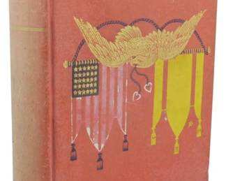 26 - 1904 1st Ed. Comrades in Arms General King (Description): Comrades in Arms by General Charles King,  first edition published in 1904. The  hardcover volume features a decorative cloth  binding in salmon/coral with gilt and  polychrome stamped illustration depicting an American eagle with spread wings above  military flags and banners. The author's name  appears stamped at the bottom of the front  cover. The book shows age-appropriate wear  consistent with its early 20th century