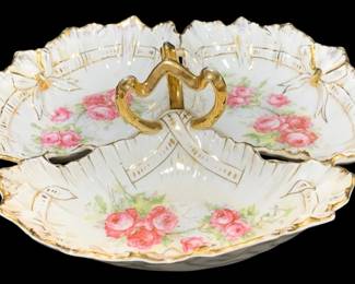 2306 - Antique Serving Dish 11" round (Description): Antique serving dish measuring 11 inches  round. This elegant piece features decorative  detailing and a centered handle, suitable  for presenting various foods or as a display  piece.