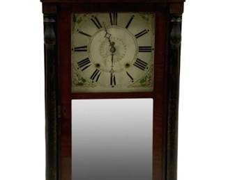 2121 - Jerome & Darrow Wall Clock 17"x5"x32" (Description): Gerome & Darrow wall clock featuring a wooden  case with flanking columns and a mirrored  lower panel. The clock displays a painted  dial with Roman numerals. Comes with 2  weights. Measures 17 inches wide by 5 inches deep by 32 inches tall. Used as is electric/electronic/mechanical  item. No guarantee all components, untested.