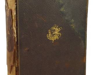 241 - 1895 Ltd Memorial Ed. Historic Characters V9 (Description): Volume 9 of The Library of Historic  Characters and Famous Events, 1895 Limited  Memorial Edition. This leather-bound volume  features a gilt decorative emblem on the  front cover with gold-ruled edges. The book shows significant wear with covers detached  from the text block and a deteriorating cloth  spine. The brown leather covers display  age-related patina and discoloration  consistent with its late 19th century