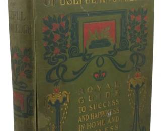 30 - 1902 Edition The Fireside Cyclopedia (Description): 1902 edition of The Fireside Cyclopedia of  Useful Knowledge, subtitled Royal Guide to  Success and Happiness in Home and Business.  This illustrated volume features a decorative  olive green cloth binding with ornate Art Nouveau style cover design incorporating red  and gold accents, floral motifs, and  architectural elements. The spine and front  cover display the title in gilt lettering.