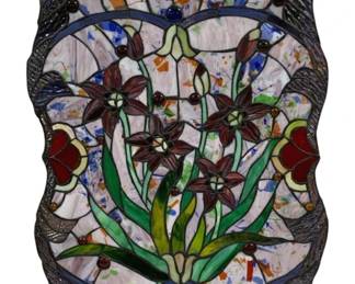 2088 - Stained Glass Wall Hanging 25"x18" (Description): Stained glass wall hanging featuring a floral  design. The piece measures 25 inches by 18  inches and includes hanging hardware at the  top corners.