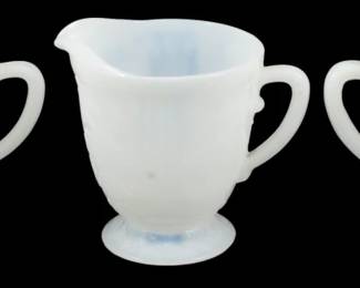 926 - Monax American Sweetheart Creamer & Sugars (Description): Monax American Sweetheart creamer and sugars  consisting of one creamer and two sugar  bowls. The pieces feature the characteristic  translucent white Monax glass with a subtle  opalescent quality and scalloped edges. Each piece has decorative handles and rests on a  footed base, showcasing the elegant  Depression-era American Sweetheart pattern.