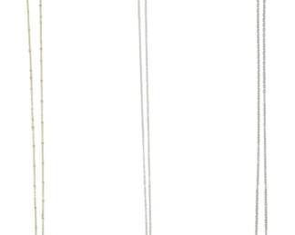 833 - 3 Gold & Silver Tone Pendant Necklaces (Description): Collection of three gold and silver tone  necklaces. The group includes a gold tone  chain with a large green agate slice pendant  featuring gold-edged trim, a silver tone  chain with a decorative bow pendant accented in pink enamel with a clear crystal center,  and a silver tone chain with a floral painted  ceramic bead drop pendant with turquoise and  pink accent beads.