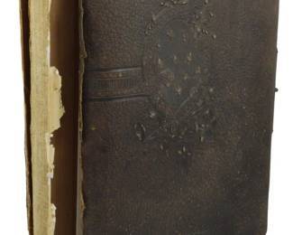 48 - Ca. 1890 Photo Album of Adelaide T. Bushong (Description): A circa 1890 photograph album belonging to  Adelaide Taylor Bushong (1837-1911). The  album features an embossed leather cover with  decorative floral and oval motifs. The spine  shows wear with exposed cloth backing. The album contains tin types and cabinet cards  documenting the period.