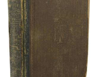 12 - 1878 Primary School Dictionary of English (Description): A Primary School Dictionary of the English  Language, 1878 edition. This antique  reference book features an embossed cloth  cover with a decorative monogram on the front  board and ornamental border details. The binding shows significant age-related wear  with rubbing to the spine and corners,  consistent with its nearly 150 years of  existence.