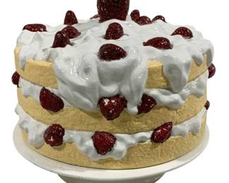 2421 - Houghton Ceramic Cake Stand w/ Top 11"x10" (Description): Houghton ceramic cake stand with decorative  top. The lid is designed to resemble a  layered strawberry shortcake with white  frosting and strawberries. Measures 11 inches  by 10 inches.