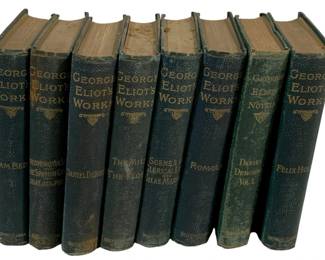2364 - 8 George Eliot's Works Books (Description): A set of eight volumes of George Eliot's  Works. The collection features matching  bindings in the classic collected works  format, presenting the literary output of the  renowned Victorian novelist.