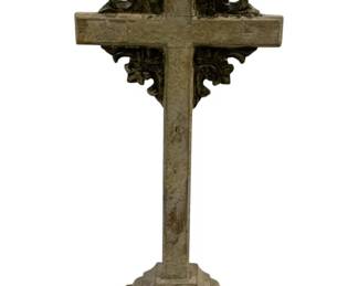 2415 - Wood Cross 17"x5"x4" (Description): A decorative wood cross featuring ornate  carved detailing. The cross stands on a  stepped pedestal base. Measures 17 inches  tall by 5 inches wide by 4 inches deep.