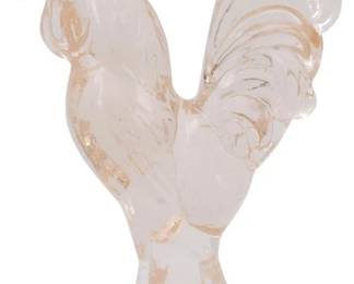 131 - Pink Glass Rooster Figure 4.5" (Description): Pink glass rooster figure featuring a  standing pose with detailed tail feathers and  a scalloped comb. The translucent pink glass  has subtle peach-toned accents throughout.  Measures 4.5 inches tall.