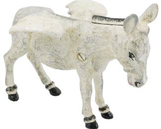 87 - Cast Iron Donkey Bank 5.5" (Description): Cast iron mechanical donkey bank with white  painted finish showing charming wear and  patina. The donkey features black painted  hooves, detailed facial features with painted  eyes, and a hinged saddle lid on the back for coin access. Measures 5.5 inches.