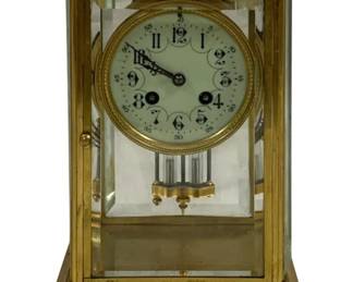2100 - French Gilt Bronze Carriage Clock (Description): Brass mantle clock featuring a glass-paneled  case with beveled edges and a visible mercury  pendulum. The clock has an ornate dial with  Arabic numerals set within a decorative brass  bezel. Measures 10 1/2" x 7" x 5.5". Used as is electric/electronic/mechanical  item. No guarantee all components, untested.