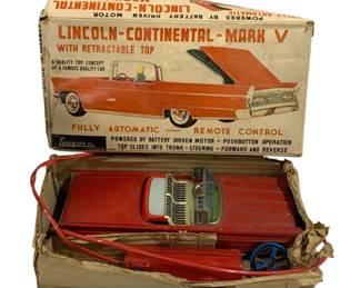 2089 - Cragstan Lincoln Mark V Remote Control Car (Description): Cragstan Lincoln Mark V remote control car in  original box. This vintage battery-operated  toy features the Lincoln Continental Mark V  with retractable top and remote control  operation. Used as is electric/electronic/mechanical  item. No guarantee all components, untested.