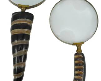 168 - 2 Horn Handle Magnifying Glasses 11" (Description): A pair of decorative magnifying glasses  featuring carved horn handles with  distinctive banded stripe patterns. Each  glass has a brass bezel securing the lens to  the ornate handle. Measures 11 inches in length.
