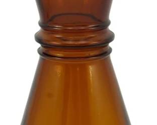 250 - Vintage Crisco Amber Glass Bottle 10" (Description): Vintage amber glass Crisco bottle featuring a  distinctive hourglass silhouette with a  cinched waist and bulbous base. The bottle  retains its original aluminum screw cap.  Measures 10 inches tall.