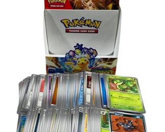 2381 - 200 Pokemon Cards w/ Box (Description): A lot of 200 Pokemon trading cards  accompanied by a Pokemon Trading Card Game  box. The collection includes various cards  from different sets, offering a diverse  assortment for collectors and players alike.