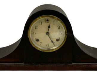 2298 - Waterbury Mantle Clock 9.5"x5"x19.5" (Description): Waterford mantle clock in a classic tambour  or Napoleon hat style. The clock features a  dark wood case with a brass bezel surrounding  the dial face. Measures 9.5 inches high by 5  inches deep by 19.5 inches wide. Used as is electric/electronic/mechanical item. No  guarantee all components, untested.