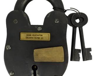 180 - San Quentin Death Row 35 Lock w/ Keys 5" (Description): This heavy iron padlock features a brass  plate engraved with "San Quentin Death Row  35" and a brass keyhole cover. The lock has a  classic heart-shaped body with visible  rivets and comes with two skeleton keys on a ring. Measures 5 inches.