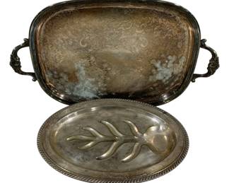 2022 - 2 Silver Plated Serving Platters (Description): Two-piece lot of silver plated serving  platters. The lot includes a large handled  serving tray and an oval meat platter with  tree well design. Measures 22" x 14".