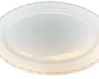 2351 - O.P. Co. Syracuse China Platter (Description): An O.P. Co. Syracuse China platter. This oval  serving platter features a classic white  center with a delicate decorative border  pattern along the rim.