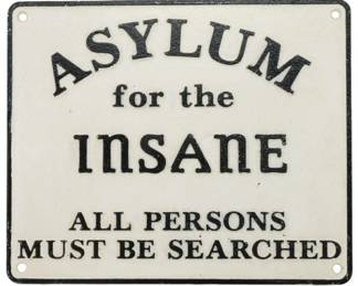 97 - Cast Iron Asylum for the Insane Sign 8.5"x10" (Description): Cast iron sign reading "Asylum for the Insane  - All Persons Must Be Searched." The sign  features black lettering on a white painted  background with a black border. Four mounting  holes are located at each corner. Measures 8.5" x 10".