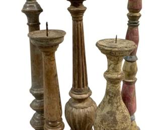2469 - 5 Candle Prickets 18"-21" Tall (Description): A lot of five candleholders in varying turned  designs and finishes. The pieces display  aged patinas with traces of original paint.  Heights range from 18 to 21 inches tall.