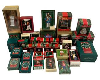 2031 - Assorted Hallmark Christmas Ornaments (Description): A collection of Hallmark Christmas ornaments  in their original boxes. The lot includes  various Keepsake ornaments featuring an  assortment of holiday designs and characters.  The ornaments come in a variety of box sizes, indicating a mix of standard and  special edition pieces from the Hallmark  ornament collection.
