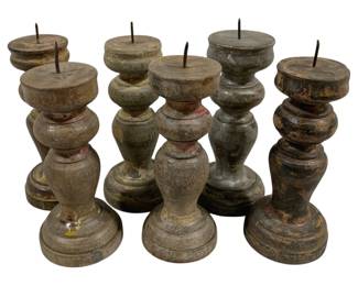 2468 - 6 Candle Prickets 7" Tall (Description): A six-piece lot of vintage wooden  candleholders featuring turned baluster forms  with metal pricket tops for securing  candles. The candleholders display weathered  painted surfaces with traces of original polychrome decoration. Each measures 7 inches  tall.