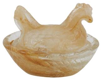 139 - Miniature Peach Glass Hen on Nest (Description): This charming piece features a hen-shaped lid  resting on a basket-weave patterned base.  The glass has a warm caramel-brown  translucent slag quality throughout. Measures  2 inches by 2.5 inches by 2 inches.