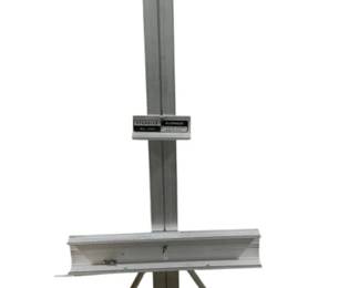 2120 - Stanrite Aluminum Easel 34"x69"x29" (Description): Stanrite aluminum easel featuring a sturdy  tripod base and adjustable height. Measures  34 inches wide by 69 inches tall by 29 inches  deep. Used as is electric/electronic/mechanical item. No guarantee all components, untested.