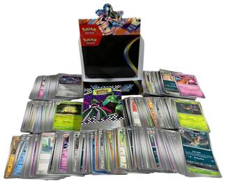 2383 - 405 Pokemon Cards w/ Box & Book (Description): A lot of 405 Pokemon trading cards  accompanied by a Pokemon box and book. The  collection includes various cards from  different sets and types.