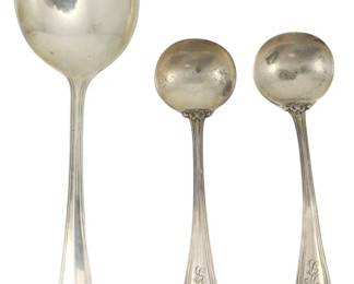 238 - 3 Sterling Silver Spoons Various Makers (Description): A collection of three sterling silver spoons  from various makers. The lot includes one  large serving spoon with a rounded bowl and  plain handle, along with two smaller salt or  condiment spoons featuring ornate handles with scrollwork decoration and engraved  monograms. Total weight is 1.25 ounces.