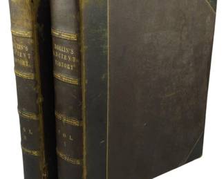 83 - 1853 American Ed. Rollin's Ancient History 2V (Description): Rollin's Ancient History, 1853 American  Edition, two-volume set. The volumes feature  half leather bindings with gilt-lettered  spines and decorative gilt ruled borders on  the cloth-covered boards. Both volumes show age-appropriate wear to the leather spines  with some rubbing and minor loss. Volumes I  and II complete the set.