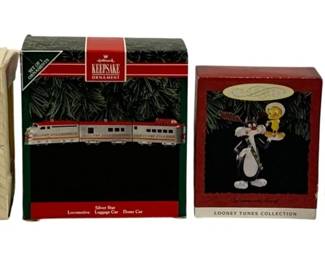 2319 - 4 Hallmark Keepsake Ornaments (Description): A lot of four Hallmark Keepsake ornaments.  The collection includes various themed  ornaments in their original boxes.